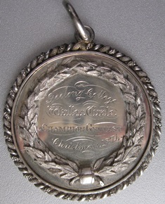 Gymnastics Medallion won by J Curle, 1874.